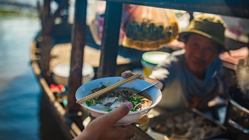 Hu Tieu noodle soup with shrimp, pork, and fresh herbs