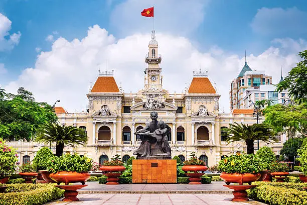 Ho Chi Minh City Hall with Vietnamese flag in District 1, Saigon
