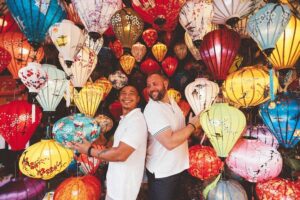 LGBT travel Vietnam – same-sex couple enjoying lanterns in Hoi An