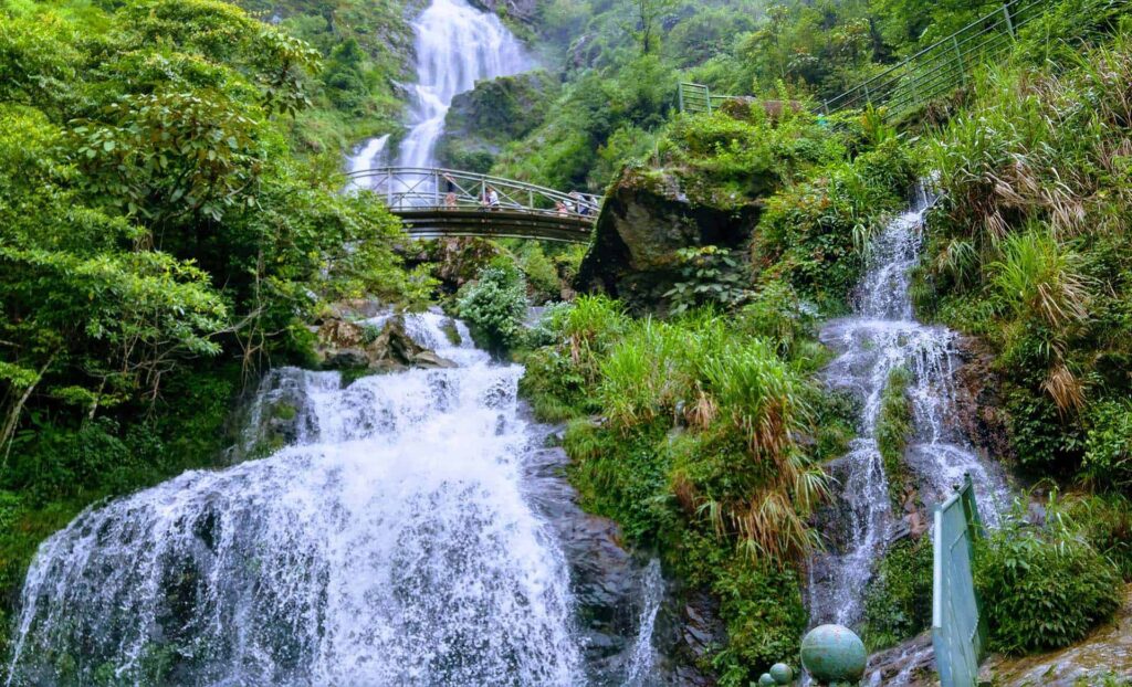 Silver Waterfall cascading through lush greenery in Sapa