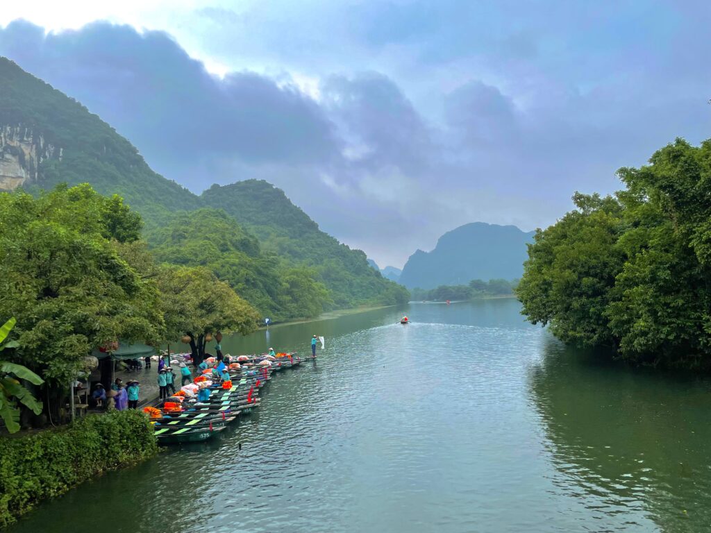 Trang An boat tour through caves and limestone mountains