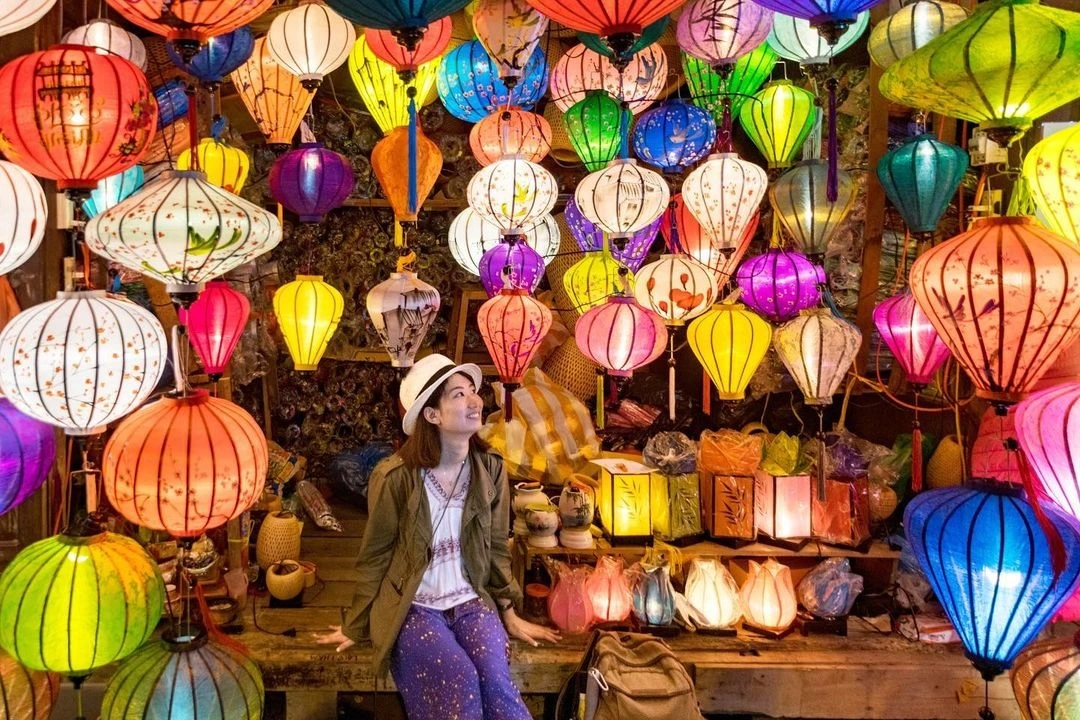 Woman exploring the lantern-filled streets of Hoi An during a cultural Vietnam holiday