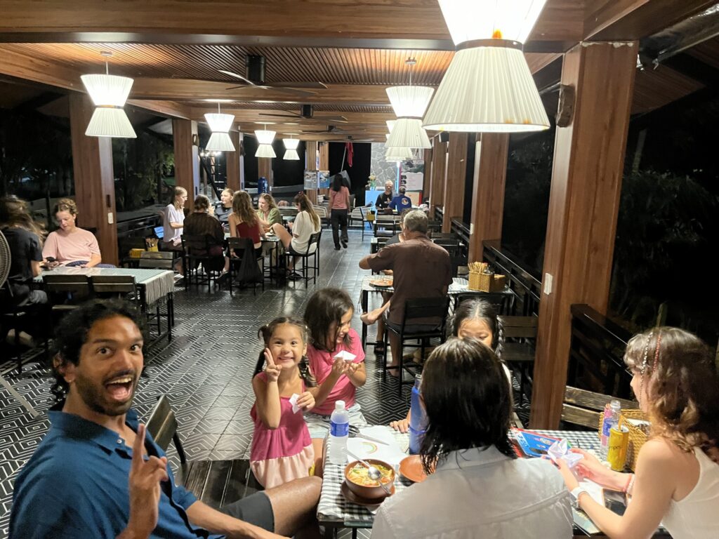 Families enjoying a warm dinner together in a local Vietnamese restaurant.