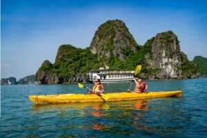 Kayaking through calm lagoons and limestone cliffs in Ha Long Bay