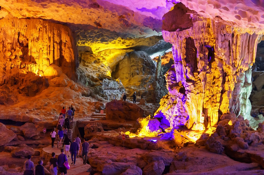 Inside a limestone cave in Ha Long Bay with dramatic stalactites