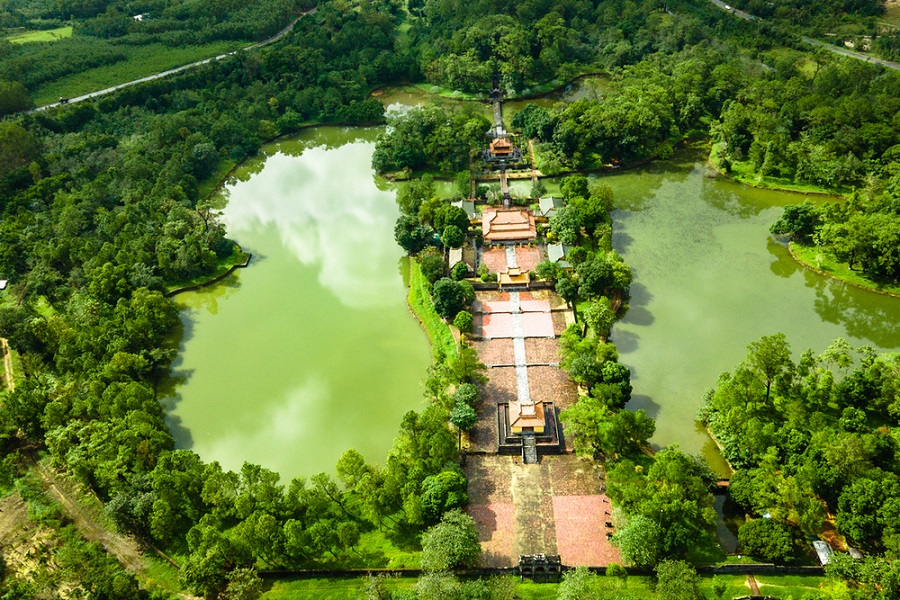 Tomb of Minh Mang in Hue with lake and traditional stone bridge