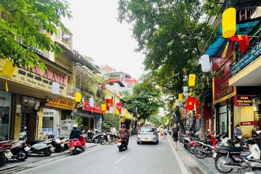 Hanoi Old Quarter street scene with traditional architecture and local life