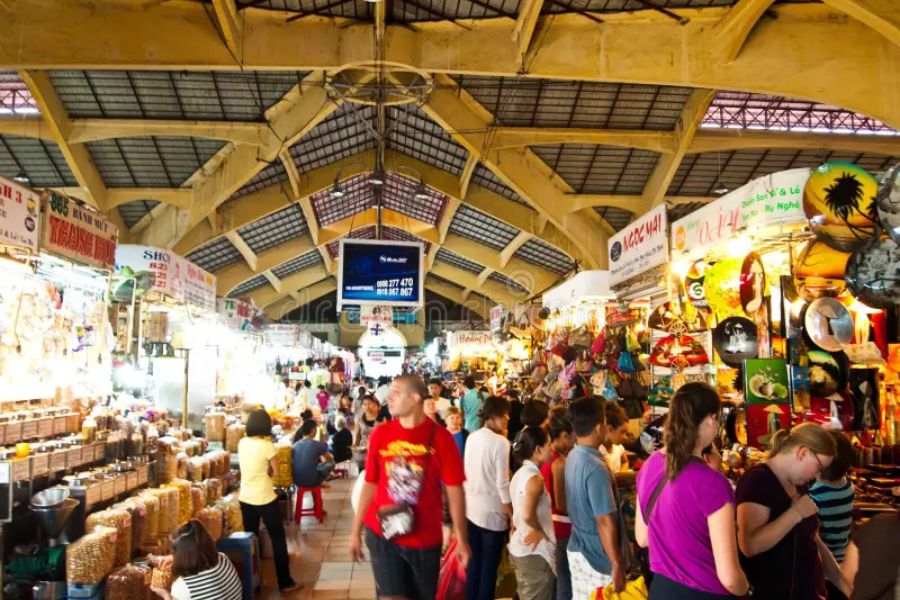 street market in Vietnam with local vendors and tourists
