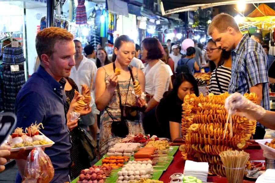 Travelers enjoying street food at Vietnam night markets