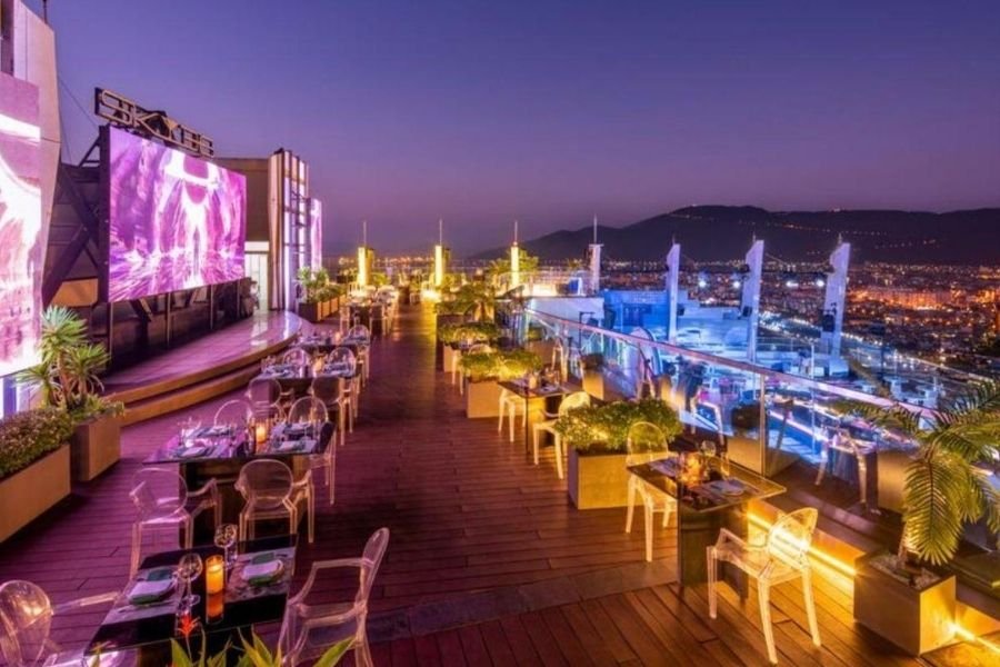 Social Club Rooftop Bar with Ho Chi Minh City skyline at sunset