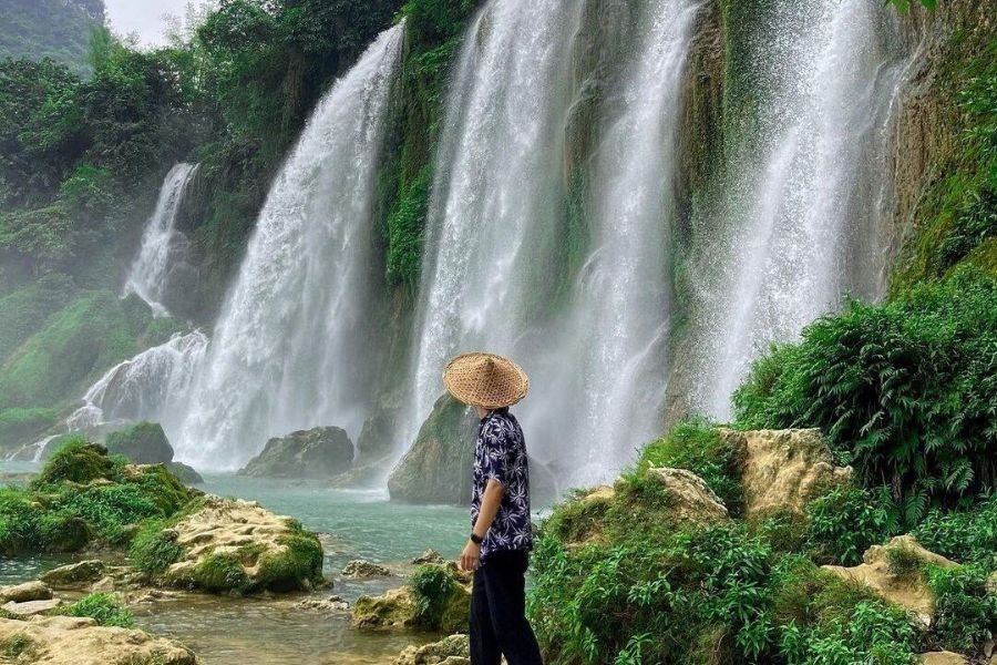 Travelers exploring waterfalls in Vietnam