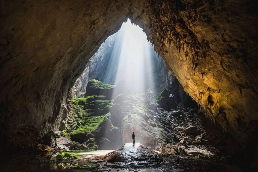 Son Doong Cave in Vietnam with sunlight illuminating its enormous underground chamber